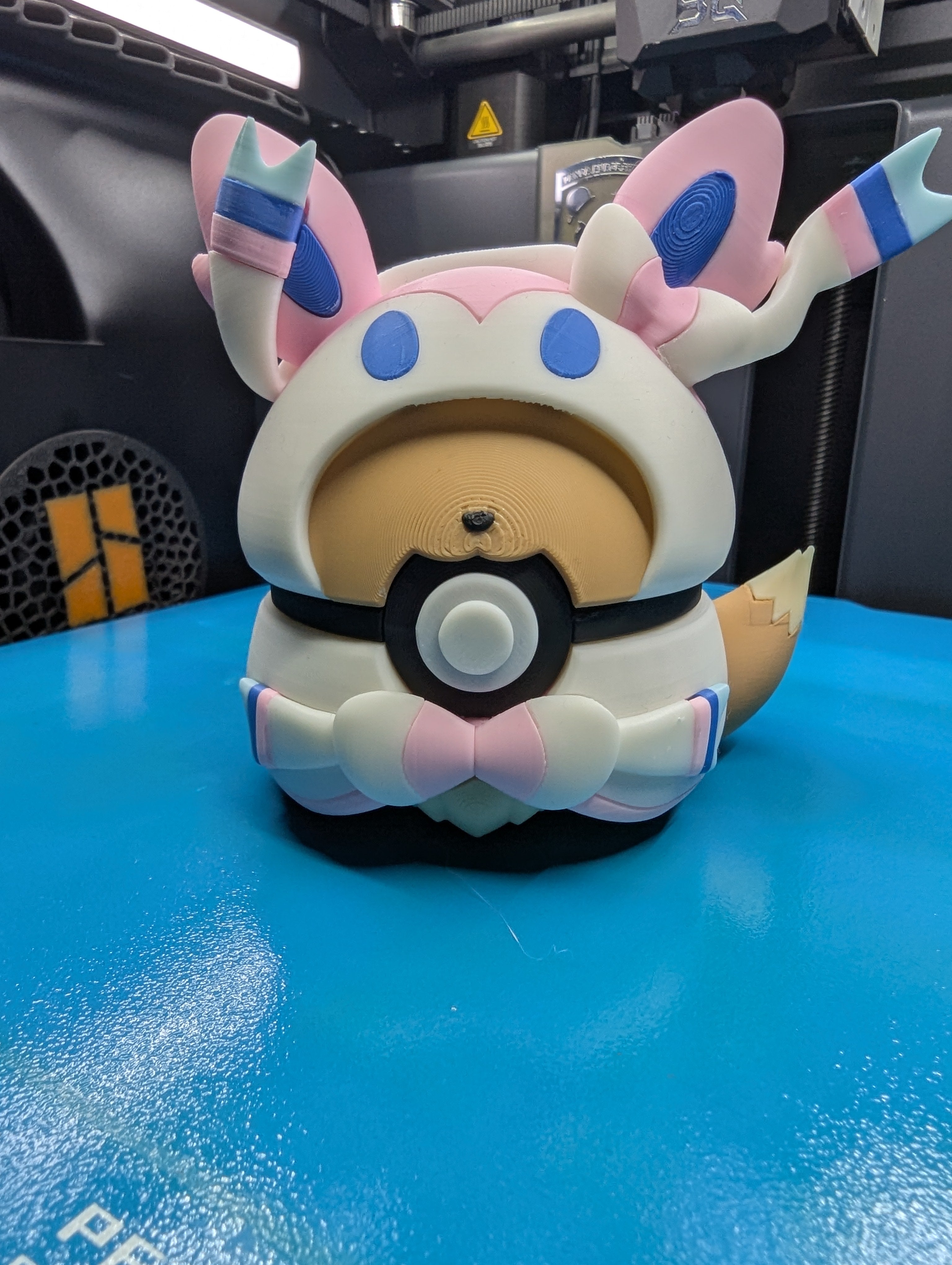 Eevee (Sylveon Poncho) Pokéball Display Model – 3D Printed Collectible Figure